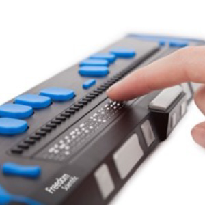 a photograph of someone holding a refresheable braille display